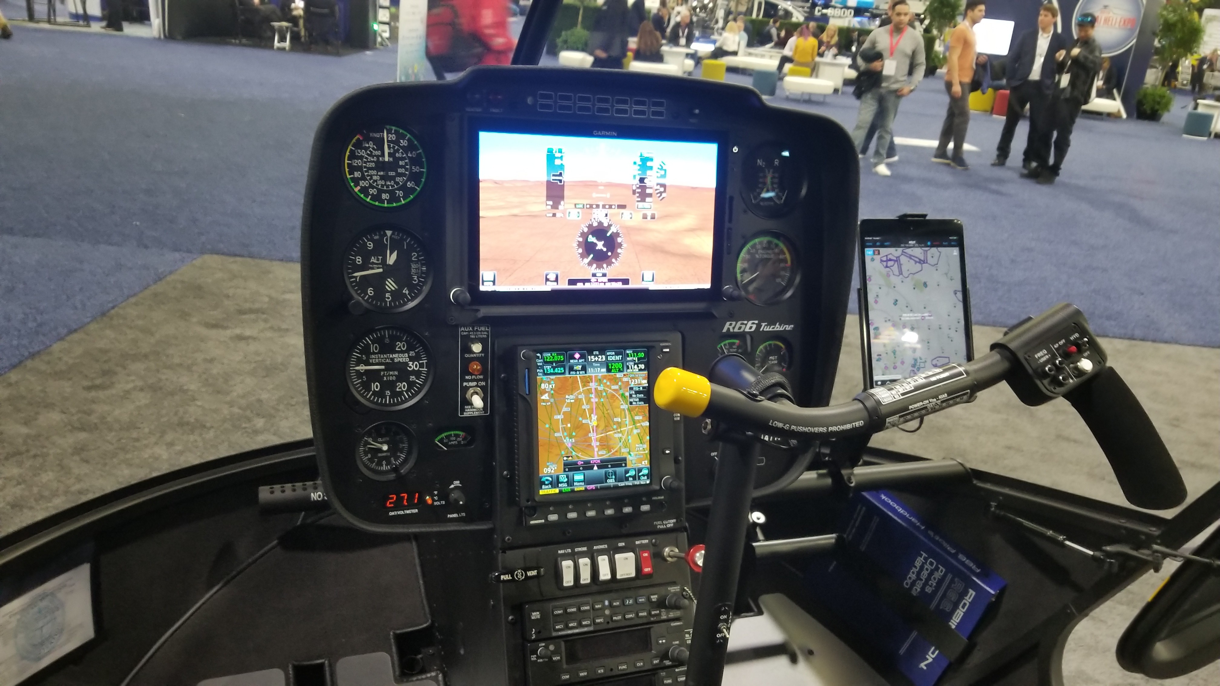 Reference Robinson R66 glass cockpit at an aviation exhibition